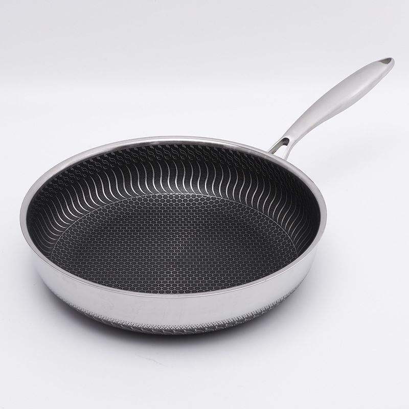 Non-stick stainless steel sauté pan with ergonomic handle and lid